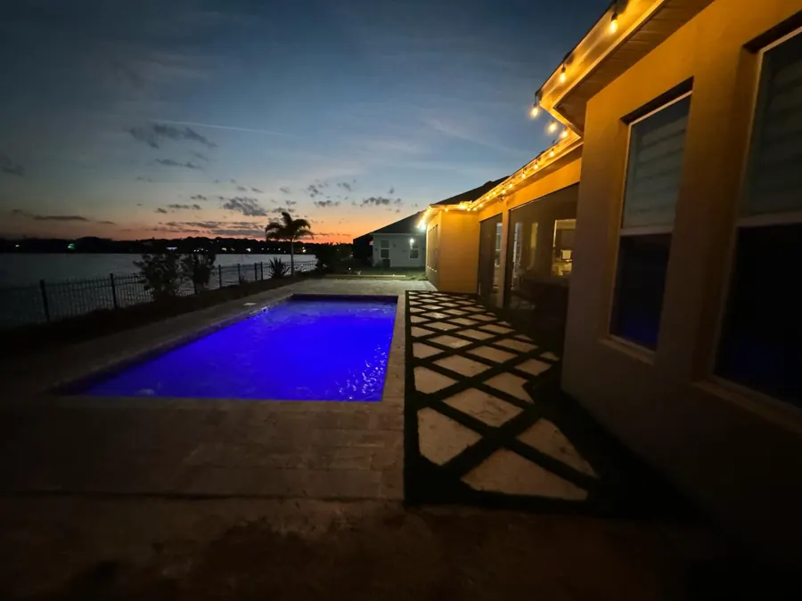 Key West pool lit up at night with LED light