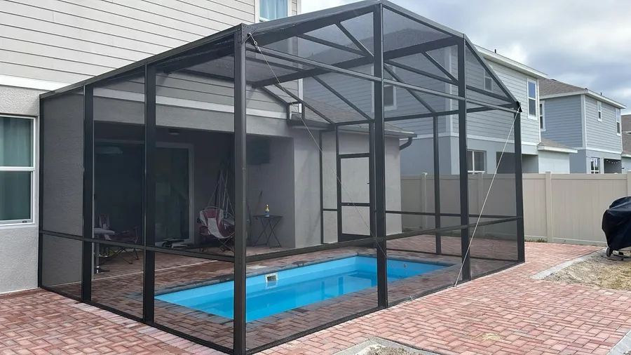 Screen enclosure next to the house