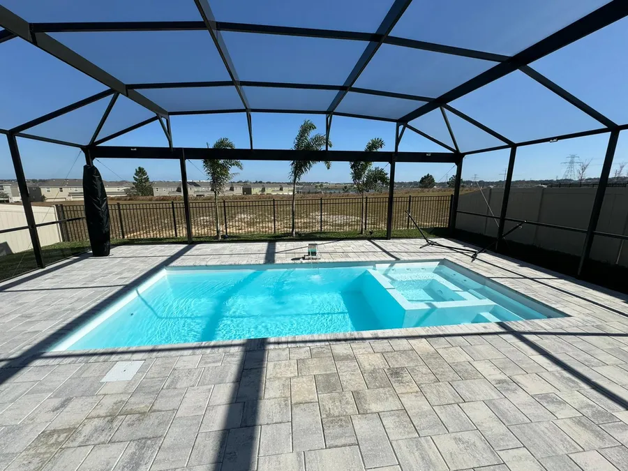 Pool and spa under a screen